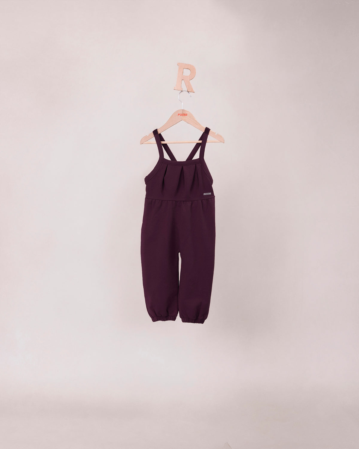 Rooie and Friends baby girls mauve pleated romper with cross-back straps