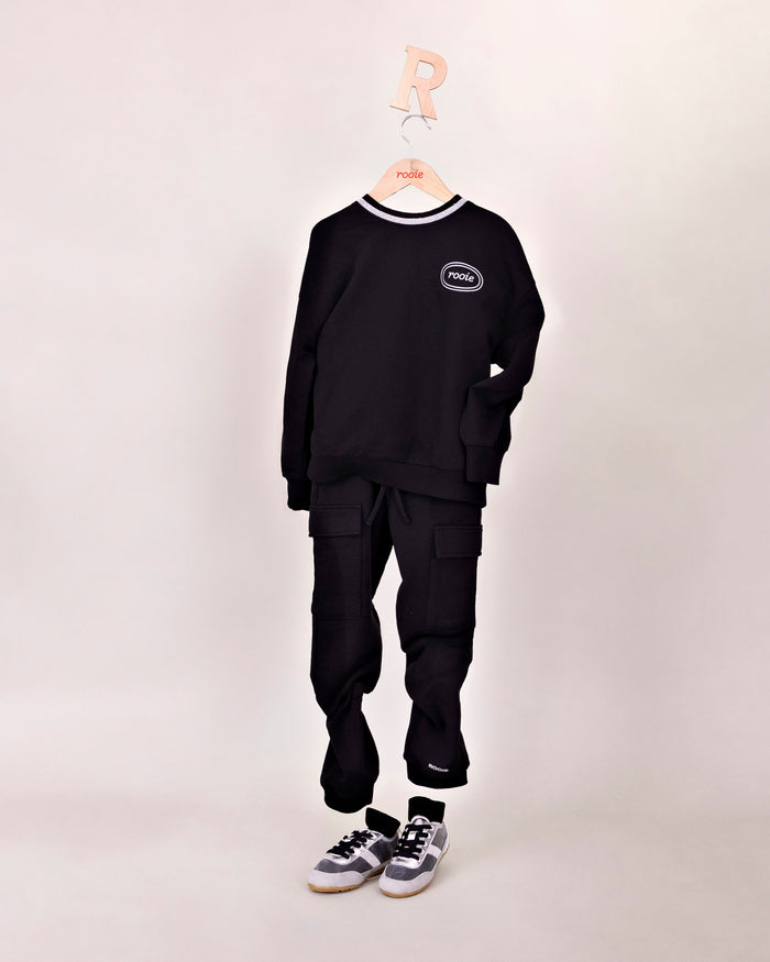 Rooie and Friends girls black logo sweatshirt with metallic silver neckline trim